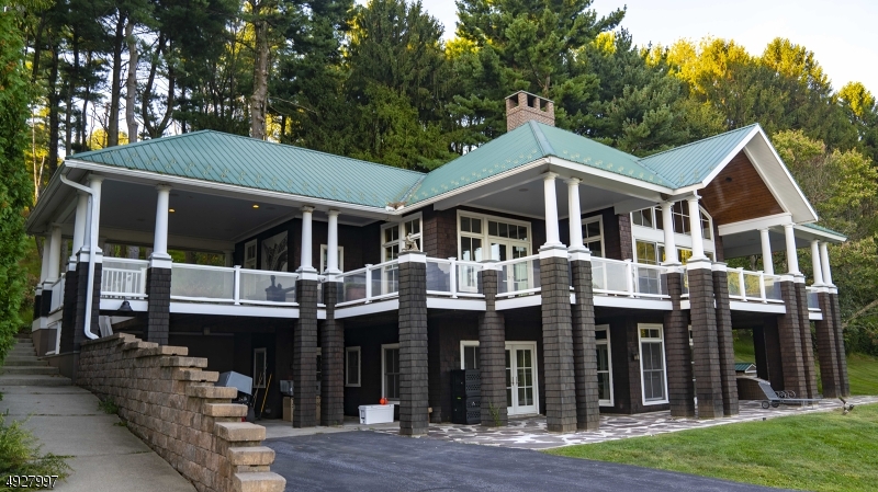 Conveniently located in Central New Jersey this state of the art training & boarding facility is fully licenced and can facilitate up to 100 animals.Nestled on 20 acres atop Scott's Mountain,amenities include a 40x50 kennel building with apartment & full bath,a historic 3 level bank barn, 40x112 complex with 2 training arenas, bath,laundry,office, reception area and storage room. All buildings are climate controlled & insulated. All kennels have in/out covered runs. The fully fenced facility boasts a separate exercise field with water oasis, pony barn,and trails.  The custom home features a desirable open floor plan with breathtaking views for 50 miles from the wrap around covered verandas,2 full wall custom fireplaces,maple hardwood floors, gourmet chefs kitchen, master suite & 2 additional ensuite bedrooms.