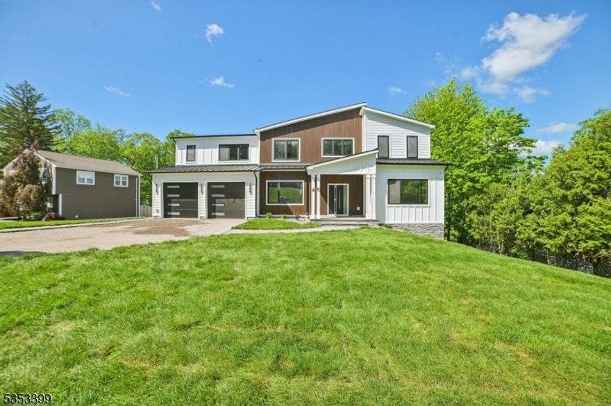 Stunning custom built 6BR/5.5BA contempory colonial with 5000+ sq ft of living space set on .44 acre lot in the best location of the best town! This home boasts spacious open floor plan,1st floor in-law suite, Livingroom, high ceiling family room and formal dining room, The kitchen is complete w high-end SS appliances, center island ,quartz counters, custom cabinets. The 2nd floor is home to 4 bedrooms, luxurious master suite , 2nd bedroom has its own en-suite, 3rd & 4th beds share a bath, laundry. Fully finished basement with 9' ft ceilings, Mud room, Media room, Rec room and Full bath. Must See!!!