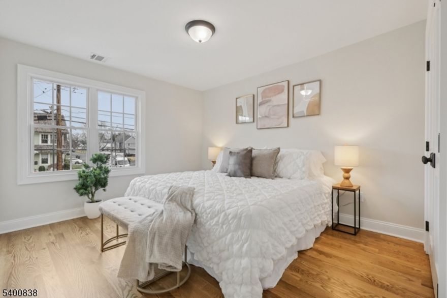 Stunning 2025 renovation and addition 4 bedroom, 2.5 bath center hall Colonial. Welcomed by a deep blue slate front porch, the first floor boasts an eat-in chef's kitchen, living room, dining room, family room and the half bath. Up to the second floor, a gracious primary suite with walk in closet, three additional bedrooms, another full bath, and a substantial laundry room await. A large basement recreation room and attached oversized one car garage round out this perfect home. Hardwood floors and designer finishes throughout. The grand, flat backyard is fully fenced and ready to turn into a dream entertaining space. Close to all downtown restaurants and shopping, schools and NYC transportation. Nothing to do but move in and start enjoying the sweet Scotch Plains life.