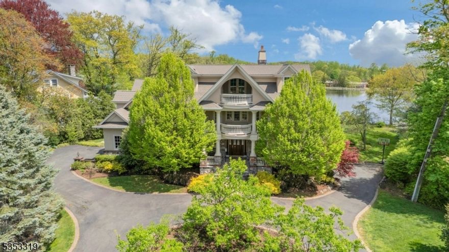 This gorgeous luxury lakefront home was custom built for you. Designed by acclaimed architect Rick Nelson and built with incomparable quality and taste, it's an architectural masterpiece ideal for casual living, entertaining, and guests. Set on .70 professionally landscaped, blooming acres overlooking scenic Wildwood Lake, you're in the heart of town, walking distance to top schools, plus preschools. Embraced by balconies, terraces, and covered porches with views, the home offers 8 bedrooms, 6 full and 3 half baths of spacious living on 4 levels. Open the mahogany front door to reveal a soaring two-story foyer with heated marble floors and a stunning double staircase. Extraordinary architectural enrichments abound. Nine-foot ceilings, 6 fireplaces with hand-carved Enkabol mantels, double crown molding, wainscotting, diagonally laid hardwood floors with mahogany borders, imported granite and marble, and more. Elegant and comfortable, the creative floor plan offers great flexibility for entertaining, offices, a gym, an art or yoga studio, in-law and au pair suites. There's a second kitchen on the lower level and garages for 4 cars. You'll love the sauna, steam showers, and jacuzzis. Wake up to spectacular sunrises over the lake from the balcony of your luxurious primary suite which also features a gas fireplace, two cedar walk-in closets and spa-worthy lakeview bath. Enjoy boating, fishing, and skating from your own dock. Resort-style lakefront living, only 30 miles from NYC!