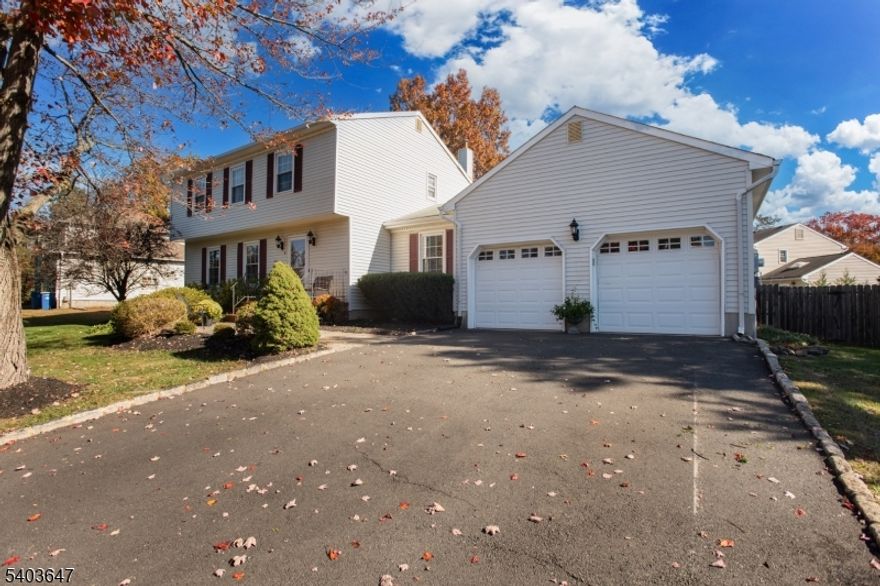 Welcome to this beautifully maintained Kingsbridge model Colonial, ideally situated in the desirable Woodfield Estates of Hillsborough Township. This inviting home showcases a recently renovated kitchen featuring timeless Fabuwood white shaker cabinetry with soft-close drawers, granite countertops, and stainless steel appliances, including a five-burner gas range, French-door refrigerator, Bosch dishwasher, microwave, and a porcelain farmhouse sink. Under-cabinet and recessed lighting complete the space with both style and function. Hardwood flooring spans the first level, while both full bathrooms have been tastefully updated with classic, refined finishes. The family room offers soaring ceilings and opens to a private backyard retreat highlighted by new composite decking, a newer oval above-ground pool, fire pit, and privacy fencing perfect for outdoor entertaining. Additional features include replacement windows throughout, a paver walkway, newer driveway with Belgian block edging, and exceptional curb appeal. The freshly painted full basement provides endless potential for future living space, whether a recreation room, home office, or gym. Conveniently located near top-rated schools, parks, shopping, dining, and major commuting routes, with Somerville Train Station approximately 15 minutes away and New Brunswick just 25 minutes.