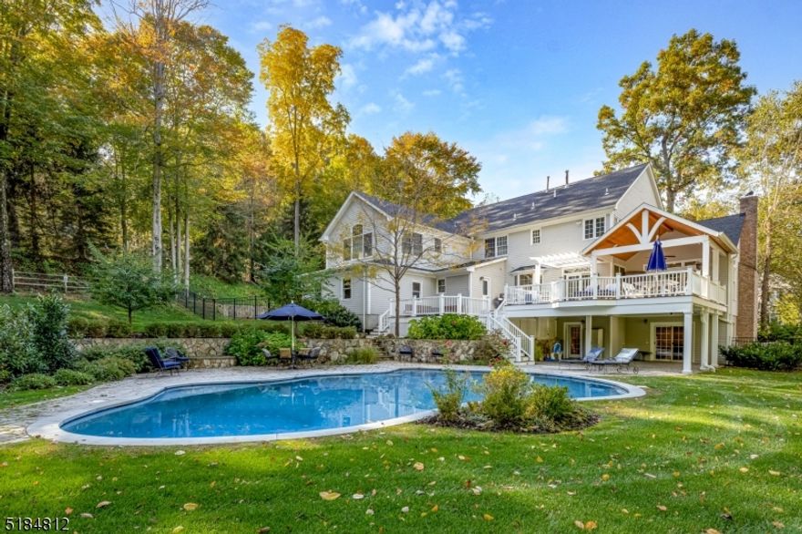 BRAND NEW TO THE MARKET! This stunning, impeccably maintained designer home is privately located in the desirable upper section in Brookrace, one of the most sought-after neighborhoods in Mendham! Custom home that boasts 5 BR, 5.1 BA, a beautifully renovated GRMT kitchen w/high-end SS Thermador APPL, modern beveled white subway tile backsplash, self-closing CUST solid wood cabinetry, extra-large center island adorned w/quartzite countertop flanked by 2 stunning chandeliers. The rest of the countertops are honed granite. The kitchen opens to a LGE multi-level Trex deck w/LRG portico, ceiling fan, TV & built-in speakers. On the 2nd tier there is a sunken hot tub overlooking the lush PVT backyard & CUST salt water, gunite heated pool with a "swim against the current" built-in feature. LGE light-filled family room w/gas fireplace, transoms, & tray ceiling that flows into the expansive LR. First floor office has built-in bookcases & desk. Spacious DR w/tray ceiling, CUST moldings & columns. The LGE light-filled PRIM BR has a tray ceiling & 2 walk-in closets. The stunning, newly renovated primary BA has 2 vanities w/quartz countertops & cement vessel sinks, marble heated FLS, w/vessel soaking tub w/waterfall spout, separate water closet w/frosted paneled pocket door, & frameless shower. The 2nd FLR 5th BR has SEP STWY ENTR, vaulted CLG, full BA & loft space. There are HW FLRS stained walnut w/honed FIN, extra-wide CUST millwork and built-in speakers.FH generator, SEC sys, SPRK Sys,