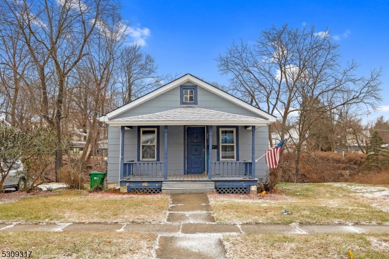 One floor living with potential to be a doll house with TLC.  Rocking chair front porch, off street parking, pine flooring, remodeled bath, thermal windows, baseboard hot water heat with oil tank in basement, but gas line in house for future boiler, attic storage, 13 year roof.  Public water and sewer.  Home being sold strictly as-is.  Photos have been staged and some walls painted by AI, not an exact depiction of property condition.