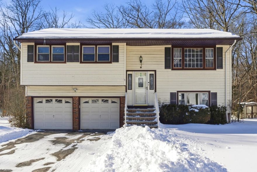 Welcome to this inviting, cozy home, nestled in a quiet neighborhood on a horseshoe street with very little traffic, known for its friendly atmosphere & convenient location. Offering generous living space, home provides an ideal blend of comfort & functionality. Step inside foyer to find bright, open living areas & large windows for abundant natural light. Main level features a welcoming oversized living room/dining room, creating a warm & inviting space to relax or entertain. At the heart of the home is the eat-in kitchen, featuring granite countertop, extended cabinets & subway tile backsplash, perfect for casual meals or gathering w/ loved ones. Dining room can accommodate a large table as a welcoming charm for your entertaining needs. Spacious primary suite is attached to the main bathroom, and other roomy bedrooms have nice-sized closets. Lower level w/ a walkout offers family room & a half bath, and flexible space perfect for a gaming area or home office. Oversized garage has cabinets for extra storage. One of the home's standout features is a large deck w/ built-in benches, and a flat backyard borders Drakes Brook & wooded open space, offering serenity & incredible opportunity for outdoor entertainment & enjoyment. Located minutes from shopping, restaurants, golf course, trails in Turkey Brook Park, schools & major roads, home offers exceptional convenience while maintaining a peaceful residential feel. Don't miss this one! New hot water heater 3/26. Room sizes approx.