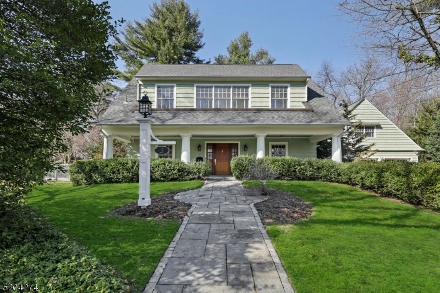 Luxurious modern amenities and updates with architectural integrity and exquisite details! Remodeled and expanded custom Craftsman Colonial boasts over half acre of parklike property with over 5000 square feet of living space + a lower level state-of-the-art Media Room! Stunning signature Craftsman elements throughout with original built-ins, exposed beams ceiling and hardwood floors located in one of Short Hills' most iconic neighborhoods less than 1 mile to NYC transportation. Front porch welcomes you to Foyer with access to Formal Living Room, large Dining Room and Powder Room. Gourmet Chef's Kitchen features high-end appliances, granite counters, center island and Breakfast area with direct patio access. Mudroom/Pantry with 2nd Powder Room next to 3-car attached garage. Family Room is open to Kitchen and to the Patio and rear yard. 2nd floor landing leads to Primary Suite with vaulted ceilings; bathroom with double vanity, steam shower and soaking tub; Sitting Room; walk-in fitted closet room; enormous bonus space currently utilized as a Home Gym with high beams ceiling and a separate office area. Junior Suite boasts separate sitting room, walk-in closet and bathroom. 2 more bedrooms, a Full Bath with radiant heated floors, and Laundry Room complete 2nd level. 3rd level provides 2 Bedrooms and Full Bath. Lower Level with Home Movie Theater, Rec Room, Powder Room and walk-in storage. Sweeping patio and lush private backyard are meticulously maintained.