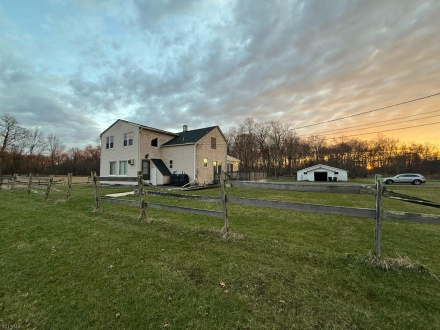 Exceptional opportunity to establish your farming operation, create a private estate, or explore subdivision potential on this prime parcel in Raritan Township. This versatile property offers both immediate income and long-term possibilities. The existing two-family home presents excellent rental income potential or can be converted into a spacious single-family residence, creating a large custom home tailored to your needs. Whether you choose to maintain it as an investment property or transform it into your dream home, the flexibility is unmatched. Adding to the property's appeal is a scenic pond, offering peaceful views and enhancing the natural beauty of the setting   perfect for enjoying tranquil surroundings or incorporating into a future estate design. A standout feature is the impressive oversized garage spanning over 2,500 square feet   ideal for car enthusiasts, contractors, hobbyists, or supporting a productive farming operation. With ample space for equipment, storage, workshop use, or creative ventures, the possibilities are truly endless. Whether you're looking to cultivate, invest, develop, or create your own private retreat, this unique property combines income potential, open space, and exceptional versatility in a highly desirable location. Must have confirmed appointment - house can be viewed on second showing - do not disturb tenants!  Property is being sold "AS IS".