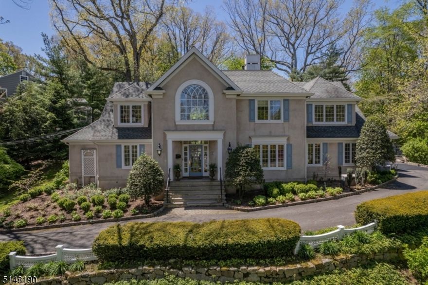 Commanding 5 bedroom custom home set in Summit's coveted Woodland Park only .3 mile to Franklin Elementary School. This majestic home offers a spectacular 2018 Heidi Piron Design/Ashley Moos Interiors collaboration chefs kitchen featuring Danby marble counters, Bluestar 20,000 BTU 36-inch, 6 burner professional range, Kitchen Aid dishwasher & Fisher Paykel dishwasher drawer, Wolf convection steam oven, Wolf microwave & Francois & CO herringbone fumed French oak floor. Guests enter through a grand 2-story foyer providing access to the formal living room which is connected to the dining room. The foyer also leads to a dramatic 2-story fireside great room with wet bar & views of the private bluestone patio, outdoor kitchen & idyllic Susan Cohan Gardens perennial garden. A mudroom/laundry on the first floor provides an entry point to the attached two-car garage. The primary suite is located on the 1st floor & includes a walk-in closet & primary bath with tub, shower & dual sinks. An alternative Primary Suite exists on the 2nd floor (currently used as a 2nd family room) along with three additional bedrooms, a Jack & Jill bath as well as an en-suite bath. The 2nd floor also has a large private office. The lower level offers a gym complete with ballet bar located next to a full bath. A large recreation room leads to an additional finished room ideal for arts & crafts or a home theatre. The unfinished portion of the basement offers storage & access by stair to the garage.