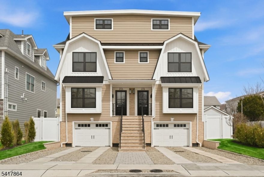 This new luxury townhome offers four finished levels of thoughtfully designed living space near Downtown Millburn with convenient access to Midtown Direct train service to NYC. Designed by renowned architect Thomas Baio, AIA, this residence blends exceptional craftsmanship, clean architectural lines, elevated finishes and functional spaces suited for today's lifestyle. The main living level boasts an open concept layout where kitchen, dining and living areas seamlessly connect. The chef's kitchen features custom cabinetry, quartz countertops and a full JennAir Noir appliance package. A large center island with beverage station, microwave drawer and designer pendants anchors the space while the living area is centered around a gas fireplace opening to a private patio and landscaped yard through large sliding doors, creating a harmonious flow with the exterior. The primary suite offers a private retreat with two custom closets, spa inspired bath with walk-in shower and a Trex balcony. An additional ensuite bedroom completes this level. The top floor introduces two flexible rooms, ideal for work or creative use, along with a full bath and Trex rooftop deck designed for entertaining or quiet evenings. Additional highlights include Andersen windows, white oak flooring, detailed millwork, custom closets, Nest thermostats, Lutron lighting, LED fixtures and central vacuum. Conveniently located near Taylor Park, local dining, shopping and Millburn's highly regarded school system.