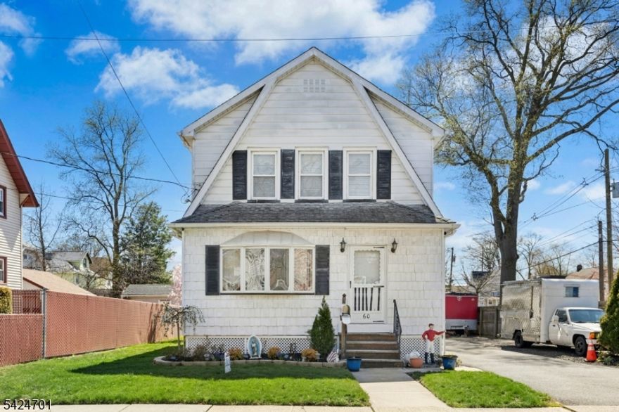 Welcome to this beautifully maintained 3-bedroom, 1-bath Colonial, perfectly situated on a desirable corner lot in a prime location close to schools, the train, and vibrant downtown amenities. This home offers timeless charm paired with thoughtful updates, creating a warm and inviting atmosphere throughout. Step inside to find gleaming hardwood floors, abundant natural light, and an open, airy feel that makes every space comfortable and functional. The updated kitchen serves as the heart of the home, featuring a center island ideal for cooking, gathering, and entertaining. Newer windows enhance both efficiency and brightness, adding to the home's overall appeal. A standout feature is the enclosed front porch, thoughtfully converted into a fully heated room perfect for a home office, playroom, or additional living space to suit your needs. Enjoy the private, spacious backyard, ideal for outdoor entertaining, gardening, or simply unwinding. A spacious detached garage provides added convenience, while the walk-up attic offers ample storage and exciting potential to be converted into additional living space, such as a bedroom, office, or bonus room. Additional highlights include a whole-house generator for added peace of mind and a clean, high-ceiling basement offering incredible potential for finishing or storage. This home blends classic character with modern conveniences in an unbeatable location, truly a must-see opportunity!