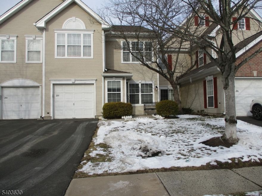 Beautifully maintained 3-bedroom, 2.1-bath townhome with an attached garage, located in the desirable Stratton Meadows development. The 1st floor features gleaming hardwood floors throughout the formal living room, dining room, and family room. The spacious, two-story family room is highlighted by a cozy gas fireplace, creating an inviting space for everyday living and entertaining. An updated powder room adds modern convenience. The updated kitchen offers granite countertops, stylish backsplash, recessed lighting, & updated appliances, with sliding doors leading to a private, fenced patio, perfect for outdoor relaxation and dining. The 2nd floor is fully carpeted and features three generously sized bedrooms, a convenient laundry room, and an updated hallway bathroom. The large primary suite boasts a cathedral ceiling, his-and-her walk-in closets, and a well-appointed en-suite bath with double sinks, a soaking tub, and a separate stall shower. Two additional bedrooms are nicely sized and share a linen closet in the hallway. Community amenities include a clubhouse, swimming pool, tennis courts, and playground. Ideally located close to top-rated Blue Ribbon schools, shopping, restaurants, and major highways (22, 28, 78, 202, 206, and 287), as well as Bridgewater Commons Mall, Wegmans, and convenient train and bus transportation. A wonderful opportunity to enjoy comfort, convenience, and community living in a prime location.