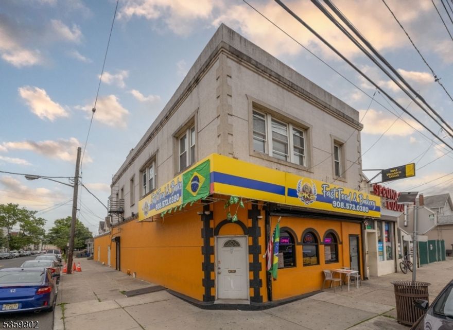 Excellent investment opportunity in the heart of Elizabethport a vibrant and growing area just minutes from the waterfront and major transportation! This high-visibility corner property features three income-generating units, including two established commercial storefronts and a  2-bedroom residential apartment. Property Features: Prime corner location with great exposure and steady foot traffic. Two commercial units currently leased and operating as a restaurant and a liquor store. Upstairs 2-bedroom apartment with a private entrance ideal for an owner-occupant or to generate additional rental income. This property is perfect for investors seeking a turnkey asset in a revitalizing area, or business owners looking to live and work in one location. With its corner presence and proximity to redevelopment projects in Elizabethport, this is a smart buy with strong upside potential.