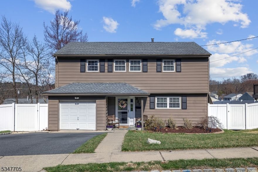 This charming 3-bedroom, 2-bath split-level home is move-in ready and offers a variety of desirable features. The spacious living room includes built-in bookshelves, providing a cozy, functional touch. The kitchen has been beautifully updated, perfect for cooking and entertaining. Gorgeous hardwood floors flow throughout the home, adding warmth and elegance. The fully fenced-in backyard offers a private outdoor space for relaxation and play, with easy access through the walk-out basement to a large paver patio with retractable awning ideal for outdoor dining and gatherings. The home also includes a 1-car garage, plus additional driveway parking for extra vehicles. Located in the sought-after Birchwood section, this home is perfect for those seeking comfort, convenience, and a well-maintained space.