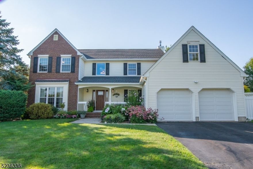 Bright & Sunny Colonial in Flanders Crossing, offering a spacious floor plan and nicely updated finishes. Walk up to this beautiful home and you're greeted by a sunny & private front porch,  ideal for sitting & enjoying your morning coffee & hear the birds sing. A 2-story foyer awaits you w/ custom moldings & ceramic tile floor. Open the French doors to the Living & Dining Rms w/ HW floors. Large Kitchen w/ Newer SS appliances. Cozy Family Rm w/ Wood Burning Fire place & step-down to the custom Sun Room w/ Hot Tub! Primary Rm has vaulted ceiling & full bath w/ soaking tub. Large Pantry/Wine Cellar in basement. Private deck & yard. Sprinkler system. Portable generator that powers the whole house included! Enjoy the community pool, tennis/pickle ball courts & Clubhouse! Don't Miss this beautiful Home!