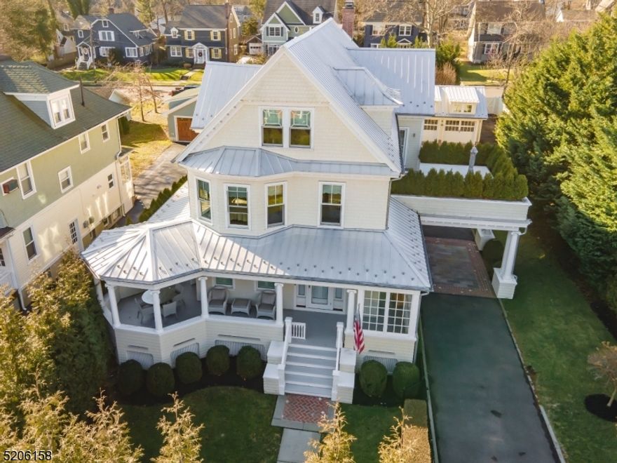 Your dream home has officially arrived as breathtaking curb appeal and premier location combine to deliver the perfect backdrop for both living and entertaining! Set upon a beautifully landscaped level lot, let one of Westfield's most coveted streets be the setting for creating endless memories for years to come. Beyond the wrap around porch you will find a stunning living room with gas fireplace, custom built ins, countless windows providing ample sunlight & a dining area with custom backlit wine cellar. Incredible flow leads to the kitchen w/carrera marble & soapstone countertops & a spacious island leading to a private family room overlooking the resort like yard with patio and heated salt water lap pool. The gorgeous master suite includes 3 walk-in closets w/built ins, an elegant bath & balcony with outdoor shower. Another brand new full bath, two additional bedrooms, a kitchen and spectacular private rooftop deck complete the second level. The third level boasts another bedroom, full bath, large sitting room & ample storage. The lower level is complete w/rec room & exercise room. Additional amenities include 7 zone Sonos sound system, 5 zone heating & central AC, whole house generator, air filtration system, AC & heated garage with electric car charger & classic 3 stop elevator. An extraordinary renovation was completed on the entire home and all within very close proximity to top rated schools, shopping/dining & NYC transportation, schedule your private tour today!