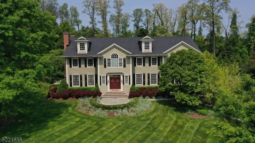 A peaceful neighborhood of estate homes is the setting for this captivating custom designed colonial, located within walking distance of schools, restaurants & downtown shopping. Set elegantly in Mendham Borough, this private, 5-bedroom, 4.1 bath oasis is filled w/ spacious rooms & designed for luxury living.  The stunning, newly updated kitchen features endless granite, custom cabinetry, designer stainless appliances, oversized center island, butler's pantry w/ full wine fridge, & breakfast room with views to the private backyard, pool & spa. The first floor also includes a formal living room & dining room, attractive family room, bedroom/office en suite, & 2 gas fireplaces.  A sweeping staircase from the impressive 2-story entry foyer leads to a large second floor office/loft. A double door entry opens to an enormous primary bedroom w/ 2 spacious closets, & newly renovated primary spa-like bath w/ soaking tub, oversized shower, quartz vanities & private commode. A beautiful ensuite w/ full bath, 2 massive bedrooms that share a large jack & jill bathroom, & oversized laundry room complete this generous space. The recently finished basement boasts an open floorplan with exercise, gaming, & entertainment areas, along w/ utilities & abundant storage space.  The meticulously manicured landscaping & gracefully curving driveway lead to the 3-car garage & fully fenced backyard paradise featuring a large bluestone patio, gunite pool & spa, built in grill & outdoor fireplace.