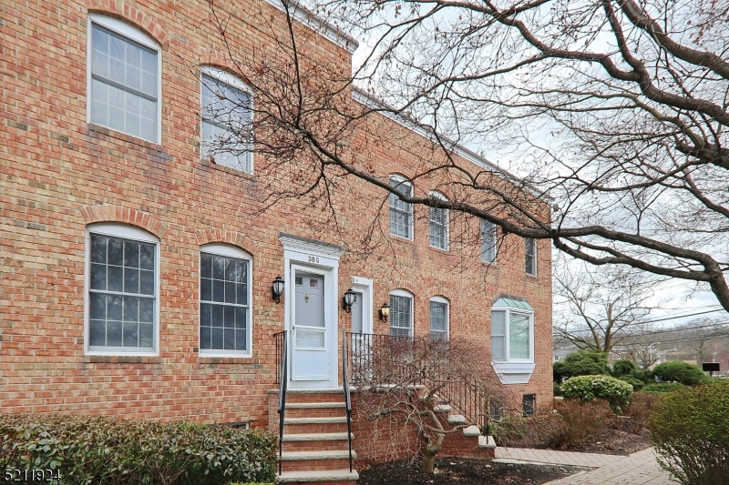 Move-in condition. Freshly painted interior - A+ location. Rare 2BR/2.2 bath brick townhouse - 3 full levels of open living space, hardwood floors on main and second levels. Spacious and light filled living/dining area and eat-in kitchen with access out to deck/balcony Finished lower level recreation room with attached garage entry, full sized laundry (washer and dryer included) and second powder room. Second floor features two bedrooms: primary bedroom complete with private bath (shower stall and oversized vanity), ample closet space and second bedroom has it's own hall bath with shower over tub. One block to train/Lakeland bus, town center and park/playground area.