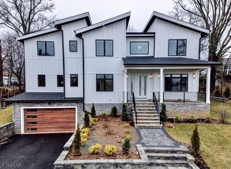 Stunning NEW CONSTRUCTION home with 6BDs 5.5BAs and 5,000 +/- sf of finished living space over 3 floors. This Custom Contemporary SMART home is set on a quiet street in the prestigious Collins neighborhood. Special features include a 2 car garage, Ring cameras outside and speakers, floating staircases, multiple fireplaces, patio overlooking lush backyard, custom closets throughout & large windows for tons of natural light. Expansive kitchen open to FR w FP & sliders to paver patio. The kitchen includes Sub-Zero & Wolf appliances, designer kitchen cabinets, lg center island w waterfall top, quartz countertop, walk in pantry & 1st floor en-suite w elec FP. The 2nd floor is home to 4 Beds w a palatial Primary Suite w a tray ceiling, electric fireplace, balcony overlooking backyard, extra storage area that can be easily finished, enormous walk-in closet and spa-like bath w soaking tub, stall shower & dual sinks, all other 2 Beds share a Jack n Jill Bathroom and 4th is an en-suite & Laundry. Finished Basement w 9' ft ceilings is equipped w a Bed/Office, Large Rec Room w a built-in bar & Full Bath. 10 YR BUILDER WARRANTY.