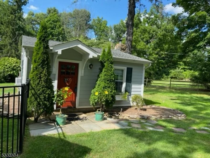 Adorable Country Cottage sits on four wooded acres. Kitchen and living room updated in 2024 (new appliances, flooring, paint, counters and cabinets).Air-conditioned for your comfort. Large private yard accessible for the tenant with attached deck for your grill and table. Entire yard is completely fenced in for your dog and the owners. One bedroom (fits queen bed) plus full bath. Full kitchen with breakfast bar. The comfortably sized living room has a beautiful wood stove and stone fireplace. Primary heat source is electric baseboard, plus an eco-friendly wood stove is included. There will be an additional pet fee. Rental is for 1 person only due to septic & well. No Smoking. NTN required for tenant plus lease application. 1.5 month security deposit and 1st months rent with an additional month which is the real estate fee.