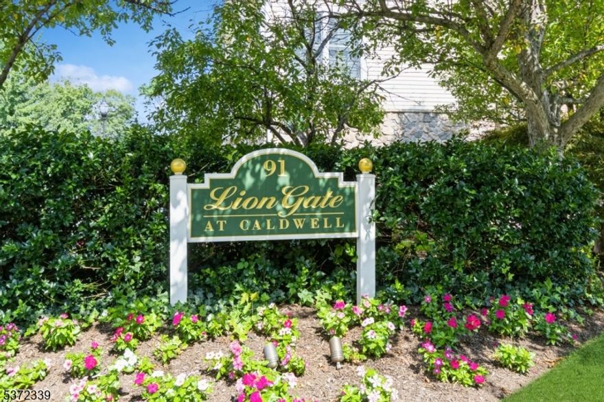 Welcome to this beautifully maintained and sought-after "Grover Cleveland  end-unit townhome offering three levels of comfortable living. The main level features gleaming hardwood floors, an updated kitchen with brand-new refrigerator and dishwasher, a dining area, spacious living room with gas fireplace, powder room, and ample storage. Upstairs, enjoy a large family room with private covered balcony, laundry with cabinetry and counter space, and a generous primary suite with two closets, double vanities, jetted tub, and stall shower. A second bedroom and full bath complete the level. The finished basement provides flexible space ideal for a home office or entertainment. The attached garage features newly painted walls and floor, plus a Tesla charger. Additional highlights include a freshly painted interior and a whole-house water softener (owned). Prime location near NYC bus, shopping, dining, parks, and recreation.