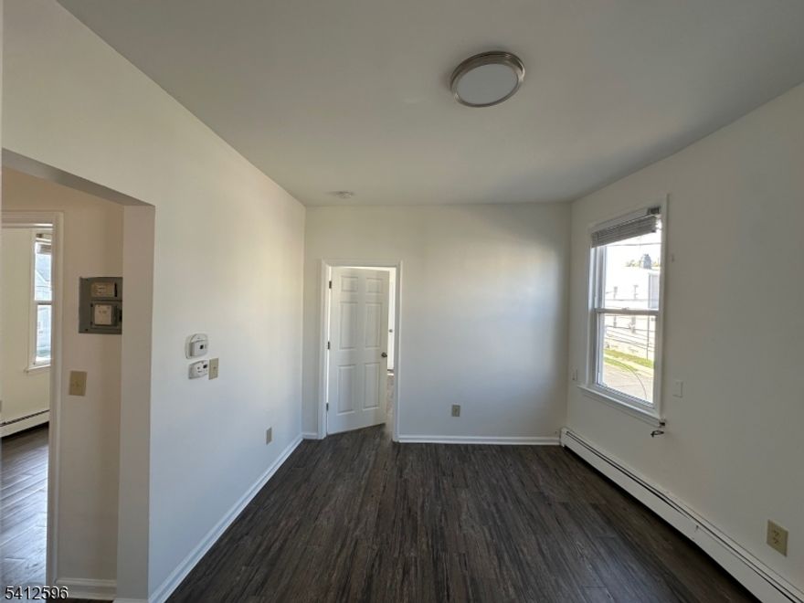 Spacious 2-bedroom apartment in Elizabeth with an additional room ideal for an office, den, or possible third bedroom. The unit offers a bright kitchen with ample cabinet space, a modern full bathroom, and updated flooring throughout. Freshly painted interior with large windows providing great natural light. Conveniently located near public transportation, schools, parks and local shops.