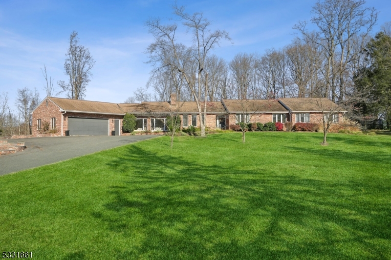 Experience the perfect blend of space and elegance in this stunning 3-bedroom, 4-full-bath ranch nestled on 3 picturesque acres in Mendham Township. This home boasts beautiful hardwood floors, oversized Pella windows, and soaring cathedral ceilings that fill the living spaces with natural light. Designed for both comfort and functionality, the property features expansive living areas, walk-in closets, and a partially finished basement. The gourmet kitchen, equipped with stainless steel appliances, opens to a tranquil backyard oasis with a heated saltwater pool. Additional highlights include public water, a fenced backyard and three storage sheds. The property's 5-bedroom septic system allows for future expansion, adding even more versatility to this remarkable home. Don't miss your chance to own this exceptional property!