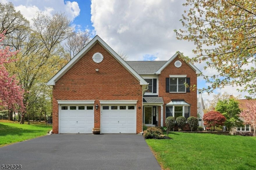 Ideally located on a quiet cul-de-sac in "The Hills," this updated Colonial offers the perfect blend of warmth, style, and functionality. Sunlight fills the interior, highlighting the thoughtful layout and elegant details throughout. From the moment you enter, the home feels bright, inviting, and designed for easy living. The open kitchen flows seamlessly into the family room, where a cozy fireplace creates a natural gathering space. Just off the kitchen, a patio invites outdoor dining and relaxation, opening to a level yard ideal for gatherings or simply enjoying the outdoors. Formal living and dining rooms feature beautiful moldings, adding timeless character and charm to the main level. Upstairs, the primary suite is a true retreat, offering a large walk-in closet with heated floors and a fully updated en suite bath featuring heated floors, a soaking tub, stall shower, and dual sinks. Three additional well-sized bedrooms share an updated hall bath. A 1st floor laundry / mudroom adds everyday convenience. The finished basement expands the living space with a recreation room, office, gym area, and half bath offering incredible flexibility for today's lifestyle. A new roof adds lasting value and peace of mind. Ideally located within a community known for its nationally ranked schools, this home delivers a perfect blend of comfort, quality, and location. Special Financing Incentives available on this property from SIRVA Mortgage.