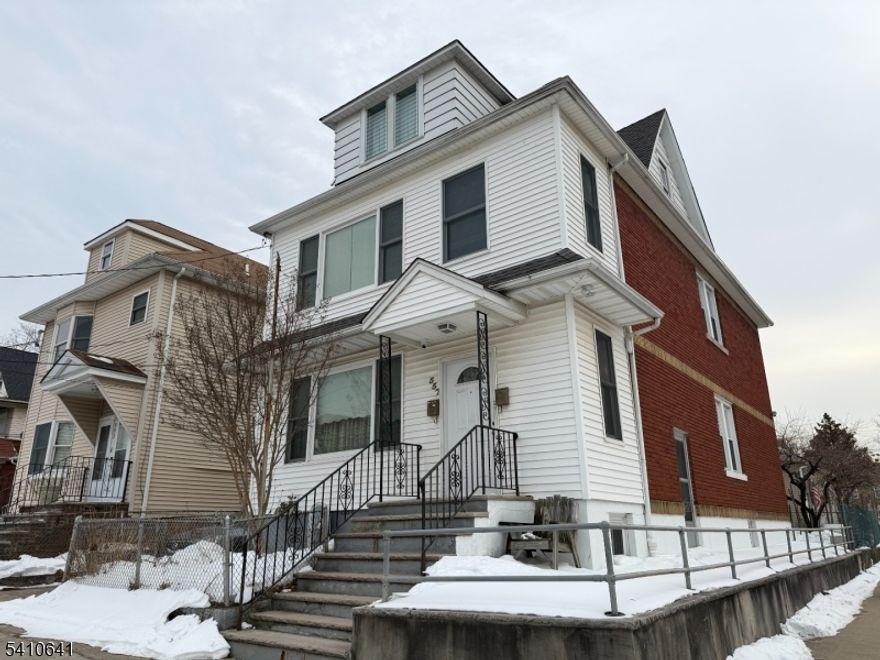 Come see this beautifully maintained second-floor apartment in a two-unit dwelling. This unit features two bedrooms, one full bath, a kitchen with a spacious dining room, living room, and an enclosed porch perfect for added living or relaxation space. The kitchen and bathroom have been renovated, and the appliances are approximately 1.5 years old. Conveniently located near shopping, public transportation, and major highways, making commuting a breeze.