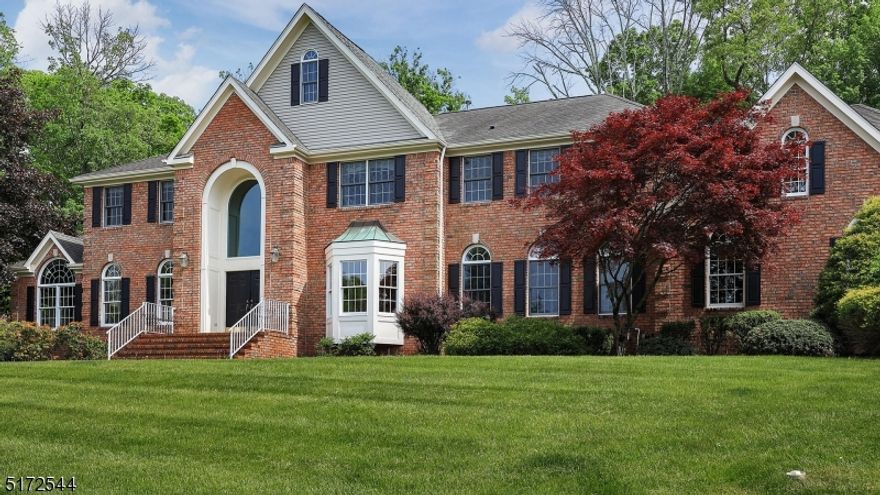 Nestled in the hills of the Watchung mountains, on a quiet cul de sac sits a stately 6 BR, 4.5 BA home with many amenities.  This bright and airy property features a 2 story foyer with a curved staircase, custom wood trim throughout the entire main level, 2 family rooms-each with a fireplace, an open concept oversized kitchen complete with a walk in pantry, wet bar, and a 2 story breakfast area with a skylight.  Relax in the sun flooded conservatory which boasts walls of windows, a vaulted ceiling, and French Doors.  The 1st floor guest room is complete with an en suite bath.  Dual staircases lead to the upper level where the primary bedroom features its own sitting area with pocket doors, 2 walk in closets, and 2 standard closets, and a spa like ensuite that is highlighted by 2 dual vanities, a jacuzzi tub that overlooks the picturesque backyard, and an oversized stand up steam shower with dual heads.  The 2 bedrooms feature a dual bath, and the other bedroom offers an en suite bath and walk in closet.  The fully finished lower level is highlighted by an additional bedroom and full bath, office space, wet bar, gym area, custom built in shelving and cabinets, and loads of space for recreation, hobbies and storage.  Decompress and enjoy nature's beauty on the beautiful blue stone patio, surrounded by a completely fenced in yard and mature landscaping.  Located minutes from downtown Warren, close proximity to highways 78/22/287, and in an excellent school district.