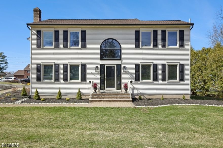 Stately, elegant & inviting describes this custom L shaped colonial nestled on a pristinely manicured corner property at the beginning of a cul-de-sac. The WOW factor begins as soon as you enter into the foyer w/soaring 2.5 story ceilings, arched palladium window & a Juliet balcony from the upper level. Two generous sized sun-drenched rooms flank, either side of the foyer currently being used as the formal LR & FR they are warm, sophisticated yet inviting.  Continue into a large open kitchen w/Quartz countertop, SS appliances, pantry & open to dining/great room this home is truly an entertainer dream home.  This main level also features a generous size laundry room, PR, oversized two car garage & access to newly rebuilt, ample size deck that overlooks the yard.  The floor plan is versatile, allowing for many options for laying out the rooms.  The upper-level features three quite generous size bedrooms w/double closets, gleaming HW floors & sizable main hallway bath. Tucked at the end of the hall is a gigantic primary suite w/ sitting area, custom walk-in closet, and spa like bath. The lower level is a blank canvas with endless possibilities!!  this full basement offers high ceilings minimal pillars and ample space to create numerous activity rooms for whatever you desire. Ideally located moments from the center of town, schools, shopping & major highways yet feels quiet and far removed.  This very special pristine custom home is not to be missed.