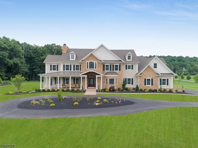 Presented by the legendary Van Holten Group, this classically chic five bedroom home is situated on 2.4 acres on a tranquil, tree-lined property.  Carerra marble, Calacatta quartz, rich millwork, DCS professional series stainless steel appliances, volume ceilings, and furniture quality cabinetry are but a few of the hallmarks of the luxury appointments that set this home apart from the ordinary.  An open floor plan, sundrenched rooms, an on-trend palette enhanced by the surrounding natural beauty, and wide plank hardwood floors add warmth and calm --  you'll never want to leave!  Relax on the front porch, or entertain a crowd in the park-like yard.  With tranquility, privacy and every convenience just minutes away, all within the top-rated Bernards Township school system, this home is a joy to call home!