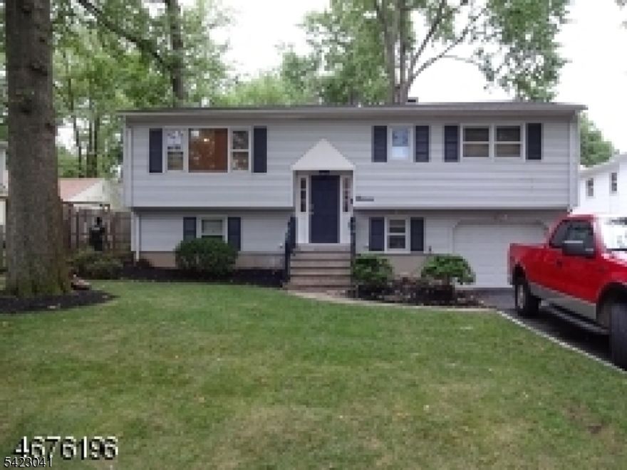 Greatly Maintained, beautiful cozy home, Walking distance to the Parsippany beautiful lake. First floor 3 bedrooms with one full bath+added full bathroom in Maseter bedroom. Hardwood floor on the first floor, second floor great size family room with wet bar & sliders to the concrete patio, close to all major highways. Great schools. complete Renovated kitchen, paint whole house, refinish hardwood floor with cherry color. renovated bathroom. Ground floor family room will be completely renovated. all new window, .