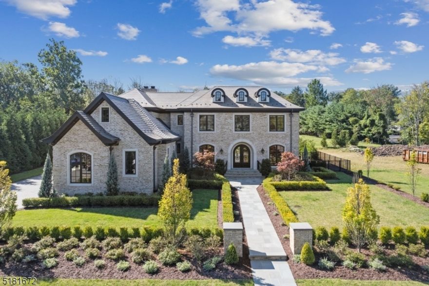 A Magnificent Estate located on one of the most desired streets in North Caldwell.  This extraordinary home has over 7,400sq ft of finished living space. Superior Craftsmanship w/Impressive Artisan Custom Detailed Moldings, 9ft Ceilings, White Oak HW Floors, Arched Doorways & Floor to Ceiling Palladian Windows throughout.   Welcomed into the Grand Foyer w/ 23ft Ceilings, a Formal Living Rm w/Gas Fireplace, Formal Dining Rm w/Butlers Pantry, & 1st Floor Guest Suite/Office w/Full Bath.  Gourmet Kitchen w/Prof Grade Appliances including Sub Zero & Wolf, Custom Inlay Cabinetry w/Lead Glass Inserts, Quartzite Counters, Oversized Center Island, Separate eating area w/French Doors leading to Outdoor Living.  Soaring 2 Story Family Room w/Fireplace & Incredible Coffered Ceilings.  Sun Drenched Great Room w/ Wood Burning Fireplace & Vaulted Beamed Ceilings.   Powder Room, Mudroom, Laundry & access to 3 Car Oversized Garage complete 1st Floor.  Second floor has a Stunning Primary Retreat w/Tray Ceilings, Custom Walk-in Closets, Luxurious Spa Bath, Soaking Tub & Makeup Station. Three Additional Large Bedrms (2 En Suite),  Incredible Chandeliers & breathtaking views to Backyard complete this level.  Finished Basement w/ 9ft Ceilings, Separate Entrance, Spacious Recreation Room, Gym and Full Bath.  Private Fenced Backyard Oasis w/Mature Landscaping, Gunite Salt Heated Pool, Turf, Patio & BBQ hookup.  Experience Luxury Living at its Finest. 10 Year Home Warranty.