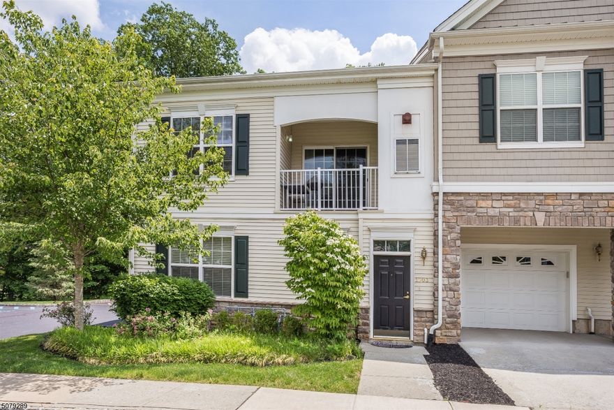 Beautiful light-filled 2BR/2BA townhouse style unit in The Grande in the Whippany section of Hanover Township. Hardwood floors throughout. Features cathedral ceilings in the living room, granite counter tops & stainless steel appliances in the kitchen. Balcony off the sliders in the dining room. Second bedroom, full bath with laundry complete the the main level. Private master suite is off the loft hallway on the second floor. Spacious custom walk-in closet & full bath. Attached garage. Enjoy the community's club house with the pool, gym, billiards & party room. Easy access to major highways, train stations and downtown Morristown.