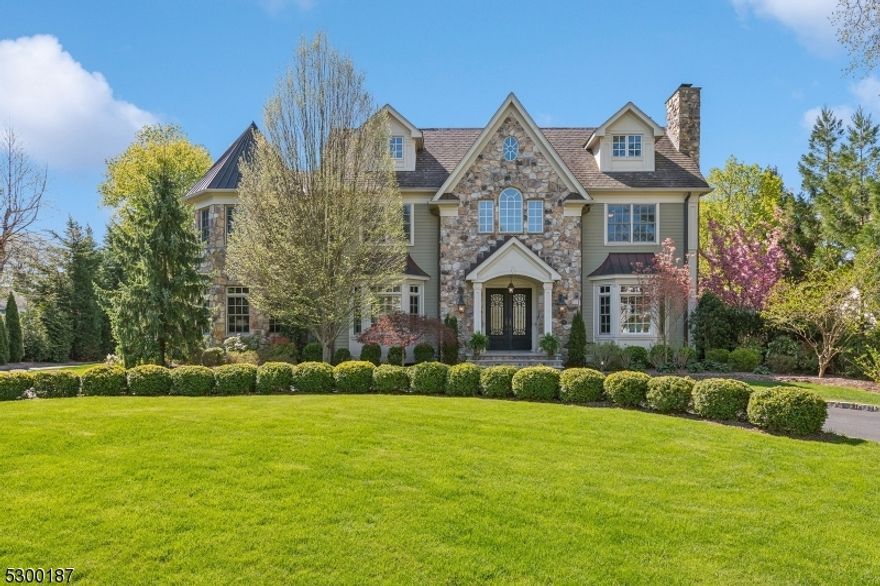 This stunning executive home in Rolling Hill sits on a quiet, winding street with striking curb appeal and lush, mature landscaping, on one of the largest properties in Chatham. Natural stone finishes, exquisite millwork, and upscale materials showcase unparalleled craftmanship by Golden River Builders. A classic layout seamlessly divides the relaxation and entertaining areas, offering distinct spaces for comfortable daily living with over 7800 sq ft of finished space. The chef's kitchen has been exceptionally designed with Miele and Wolf appliances including an espresso machine, 2 dishwashers, 3 ovens, and 2 built-in beverage drawers plus a Sub-zero refrigerator. On the 2nd level, you'll find 5 bedrooms, each with its own ensuite, including an expansive primary bedroom with walk-in closet and spa bathroom. An additional bedroom and full bath are located on the third level, along with 2 versatile spaces for a potential home gym or additional storage.  The finished basement boasts a kitchenette plus another bedroom and full bath; perfect potential for an in-law suite. A wine cellar, fully ventilated cigar room, and 2 fireplaces round out this lower level. Outside, entertain with a fully-loaded outdoor kitchen, gas firepit and fireplace, all within the peaceful confines of a fully fenced-in backyard. With its prime location just under an hour from Manhattan, this is a rare opportunity to own a masterpiece in a highly sought-after neighborhood.