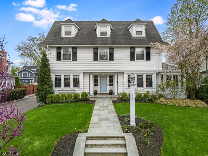 Absolutely STUNNING five bedroom, five bath center hall colonial situated on one of Westfield's most desirable streets in the Washington School district just a few blocks from Downtown Westfield shops and restaurants & close to all schools! The high end kitchen renovation features a gourmet eat-in kitchen with center island, custom white cabinetry, soaring ceilings, top-of-the-line appliances (including a show-stopping Le Cornue range), and a spacious island that opens to the family room with views of the private, professionally landscaped backyard complete with a bluestone patio and fire pit. The sun-filled living room with a wood-burning fireplace, elegant formal dining room with wet bar, home office, powder room, and a well-designed mudroom with built-ins round out the first floor. The second and third levels offer five generous bedrooms and three full baths, including a luxurious primary suite with gorgeous private bath w/steam shower & a walk-in custom closet. The beautifully finished basement features a large rec room, exercise room, wine cellar, kitchenette, and bathroom. Additional highlights include an irrigation system, built-in sound system, generator hookup, fenced-in yard, and so much more! Driveway NOT shared.