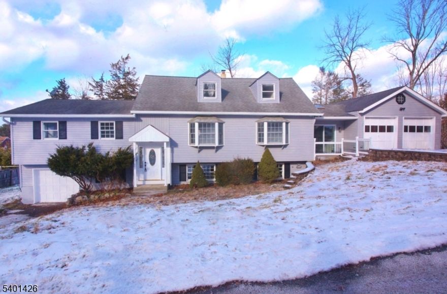 GORGEOUS & NEWLY RENOVATED CUSTOM HOME! This STUNNING 13 ROOM Beauty is Extra Spacious w over 3000 sq. ft. Boasting 5 Bedrooms & 3 Full Tastefully Modern Baths. This 3 level home features a Large lower level  walk-out Family Room. The Open floorplan makes it a dream for entertaining. Opening out to multi-tier decks and a Beautiful above ground pool for Summer fun and relaxation. No worries here everything has been done including the brand new Septic!, Multi zone Heating System & Central Air. 2 Car Garage. Kitchen w Quartz Counters & Center Island. This home is the stylish retreat you've been looking for. The breezeway is the perfect mudroom for dropping your boots, keeping your bikes, Dog leashes or anything else you don't want taking up space in the garage. Fully Walkout Lower Level with 2nd Kitchen, Bath, office and Bedroom.. All located in the peaceful community of Lake Tranquility where you can enjoy the perfect combination of nature and fun! Optional membership to the lake affords you the ability to take advantage of all the amenities living in a lake community offers such as swimming, fishing, electric motor boating, canoeing, or kayaking. Minutes to famous Tranquility Farm offering fresh produce, farm-raised meats, baked goods. ice cream & yearly events. Near to restaurants and shopping and more. Not far from 80 for commuting. This one is truly a find!