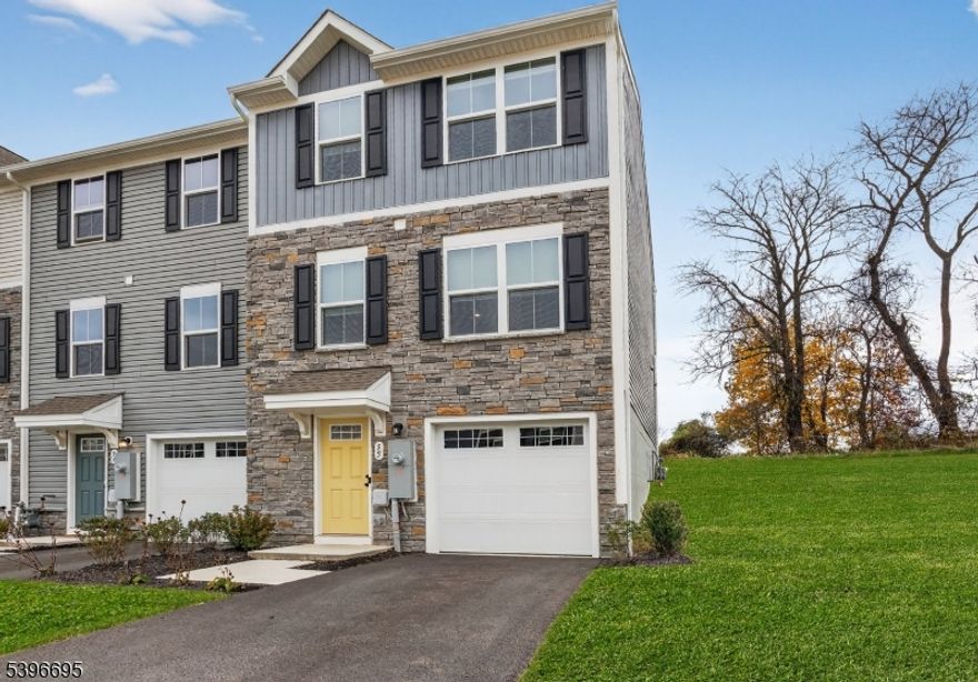 MOST PRIVATE LOT / BEST LOCATION in the Community is this 2024 Newly Built End-Unit Townhouse situated in highly sought-after Nature's Legacy section of Hawk Pointe Towns by Ryan Homes. Upon entry you are greeted with a large entry way including convenient Garage access, a Coat closet, and a BONUS Office / Recreation space. Enjoy an Open-Concept Floor Plan with an upgraded Kitchen highlighted by gorgeous Quartz Countertops, Center Island, custom Backsplash & Stainless Steel appliances that flows into a bright Living area. Home features Luxury Vinyl Plank flooring on the main and lower levels. The Primary Suite includes an En-Suite Bathroom offering a Walk-In Shower and a custom spacious Walk-In Closet. Outdoor living at its finest offering a private setting with scenic views, a Deck with walk-off stairs to a spacious Backyard & Sideyard incredible for hosting & entertaining. Conveniently located with access to Route 31 and just a short drive to Route 22 and I-78 making this home a commuters Dream. Come make this home yours before someone else does!