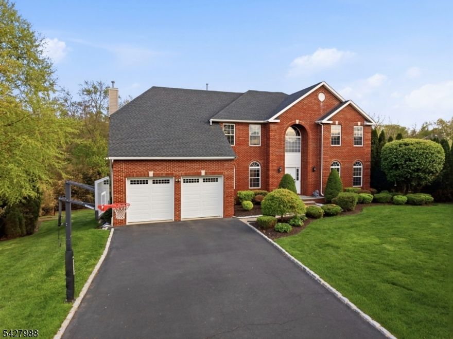A RARE, ONE-OF-A-KIND home in prestigious RIDGEWOOD ESTATE, Monroe! This fully upgraded 5-bedroom, 4-bath contemporary sits on a quiet cul-de-sac, offering luxury, efficiency, and modern design. A dramatic two-story foyer opens to a spacious family room and designer kitchen with oversized windows overlooking a private wooded backyard. The expanded chef's kitchen features Wolf & Sub-Zero appliances and is ideal for everyday living and entertaining. The first floor includes radiant heated floors, plus a bedroom and full bath, perfect for guests or flexible living. All bathrooms are fully renovated with premium finishes and lifetime warranties on faucets and showers. The primary suite offers a private balcony, and the fully finished lower level with exterior access includes a half kitchen ideal for added living or entertaining space. Enjoy outdoor living with a covered patio, deck, and built-in kitchen. Upgrades include a 2-zone system with 3 thermostats, Cat 6 wiring, EV charger, energy-efficient hurricane-resistant windows, water softener, and filtration system. Major value features: Owned solar panels (approx. $8,000/year savings), radiant floors (approx. $1,000/year savings), and a newer roof (less than 4 years) with a 55-year warranty an estimated $50,000 advantage. Move-in ready. Exceptionally upgraded. Unmatched in design, efficiency, and setting. This is not just a home, IT'S A STATEMENT.