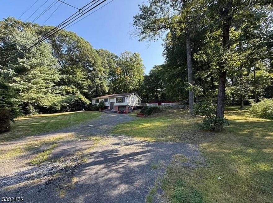 DEED RESTRICTED property for Long Term Investors. Discover lakeside luxury in this stunning, fully renovated 5-bedroom, 2-full-bath single-family home nestled in the heart of highly sought-after Lake Hopatcong. Perfect for a serene escape with modern comforts, this gem blends timeless elegance with contemporary flair, offering effortless indoor-outdoor living just steps from the water's edge.Step inside to sun-drenched rooms bathed in natural light, where gleaming hardwood floors flow seamlessly throughout. The showstopper is the brand-new gourmet kitchen a chef's dream with sleek granite countertops, a spacious breakfast bar for casual gatherings, and top-of-the-line stainless-steel appliances. Ample cabinetry ensures endless storage, while recessed lighting adds a warm, inviting glow to every meal prep. Five generously sized bedrooms provide ample space for rest and relaxation, complemented by two pristine full bathrooms. Stay cool year-round with efficient central air conditioning, and cozy up in winter thanks to reliable hot water baseboard heating. Outside, your private oasis awaits: a fully fenced backyard ideal for pets and play, a convenient driveway and attached garage for easy access, and a expansive deck perfect for al fresco dining or sunset views over the lake. Whether hosting summer barbecues or quiet evenings under the stars, this home delivers the ultimate lakeside lifestyle. Don't miss your chance to own a piece of Lake Hopatcong paradise