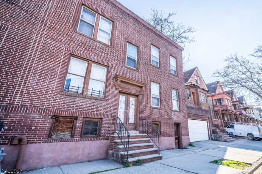 Well-maintained two-family brick home in Jersey City's Greenville section, offering two identical units with 2 bedrooms and 1 full bath each. This property features updated interiors with wood-tone flooring, neutral paint, decorative wall paneling, and refreshed kitchens that include gray cabinetry and dark countertops. Each unit offers bright living spaces and updated bathrooms, providing a clean and functional layout ready for occupancy. Situated on a 52.09   25 lot, the home includes a durable brick exterior, asphalt roof, gas radiator heat, and public utilities for consistent maintenance and efficiency. Delivered vacant, this property allows for immediate occupancy or rental setup. Conveniently located near parks, schools, shopping, and transportation options, this property is a practical choice for both investors and owner-occupants.