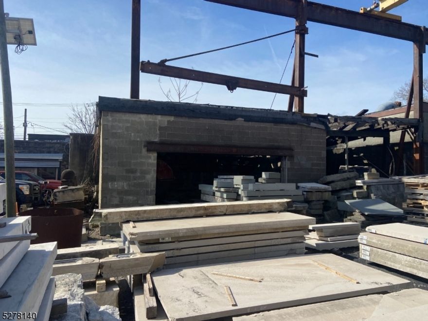 Building and Business for Sale.    The subject property consists of a 17,201 SF Lot improved with 2 Free Standing Buildings consisting of a 8,000+ SF Industrial Building and an 1,100 SF Office.  The lot is zoned Industrial and has been used as a Stone Fabrication Facility for many years.    The main structure consists of an 8,000+ SF Industrial building that has an entrance on Oraton Street with an 11'ft Drive in Door along with (3) 12'ft Drive In Doors and (2) Roll Up doors that front the properties 8,100+ SF Lot.  The ceiling heights range from 12' to 16' ft. This building could be divided into two separate units.   The Office building, which has 1,100 SF of space, is a free-standing building located in the rear of the property and has its own separate entrance via Grafton Avenue.  The owner of this property also leases' a small portion of the rear property from Norfolk Sothern Corp. Railroad.   The monthly rent is $300.00 and the lease has been month to month for years.