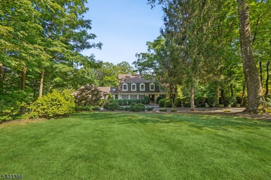 Designed with comfort, flexibility, and privacy in mind, this exceptional custom Colonial is ideal for today's lifestyle. Set on over four acres of beautiful land, this home offers a peaceful retreat while providing generous space for living or entertaining. With six bedrooms, four full baths, and two half baths, including a thoughtfully designed in-law suite, the layout is both functional and inviting. A rare highlight is the presence of two primary bedrooms, conveniently located on the first and second floors, offering versatility for guests or long-term living arrangements. Step outside to your own private oasis, where a two-tier deck, expansive patio, and inground gunite swimming pool create the perfect setting for summer gatherings, quiet mornings, or evening entertaining all with serene wooded views as your backdrop. Inside, the walk-out lower level recreation room provides additional living and entertaining space, while the three-car garage with direct entry adds everyday convenience. This is a truly special property that combines timeless design, thoughtful updates, and a setting that feels both private and welcoming perfect for making lasting memories.