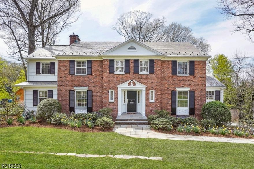 This stately 5 bedroom Woodland Park Brick front Colonial exceeds expectations! Beautifully renovated with Hoffman Design Build 3 story addition and tasteful enhancements throughout.  Exceptional living space with first floor living room, family room, sitting room, home office as well as beautiful marble eat in kitchen and formal dining room. 2017 renovation included an entertaining pantry and first floor laundry room.   Primary suite has 2 large custom closets - one walk in and the other a massive dressing room.  Marble clad primary bath and gorgeous sunset views over private rear yard too.  3 additional bedrooms and 2 hall baths complete this level. The lower level includes large walk out recreation room, 5th bedroom, full bath, home gym and entrance to oversized 2 car heated garage w epoxy floor and organization system. Great outdoor entertaining with deck and fully fenced private back yard capturing dramatic sunset views.  2023 Newly painted exterior, two zone HVAC, extensive outdoor lighting and professional landscaping.  Franklin elementary school.  Mint condition offering lifestyle and location!
