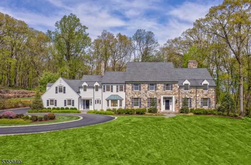 An exceptional Bernardsville Mountain residence offers spacious living and effortless entertaining, both indoors and out. Set atop a gentle hill amid 5.3 acres of beautiful landscaping, this five-bedroom home invites refined living in one of this historic former mountain colony's most desirable locations. Surrounded by established landscapes and stone walls, the setting is completely private. Its sun-drenched interior is spacious and thoughtfully designed, with well-appointed rooms and a gracious flow. At the heart of the home is a stunning designer kitchen featuring two large islands, custom cabinetry and top-of-the-line appliances including a La Cornue French range. A bright sunroom and elegant living room both open to a bluestone patio with an outdoor fireplace and pool for easy indoor/outdoor entertaining. Also on the first floor is a home office with a gas fireplace and charming bar. On the second floor, an expansive primary suite includes a sitting area with a cozy gas fireplace, two roomy walk-in closets and a spa-like bath with a soaking tub and ample natural light. Four additional bedrooms each have updated baths and custom California Closets. The finished basement provides additional living spaces in a media room, oversized recreation room, wine cellar and a full bath. Situated just minutes from downtown Bernardsville's shops, restaurants and Midtown Direct trains, this distinctive residence perfectly balances peaceful country living and convenient access to town.