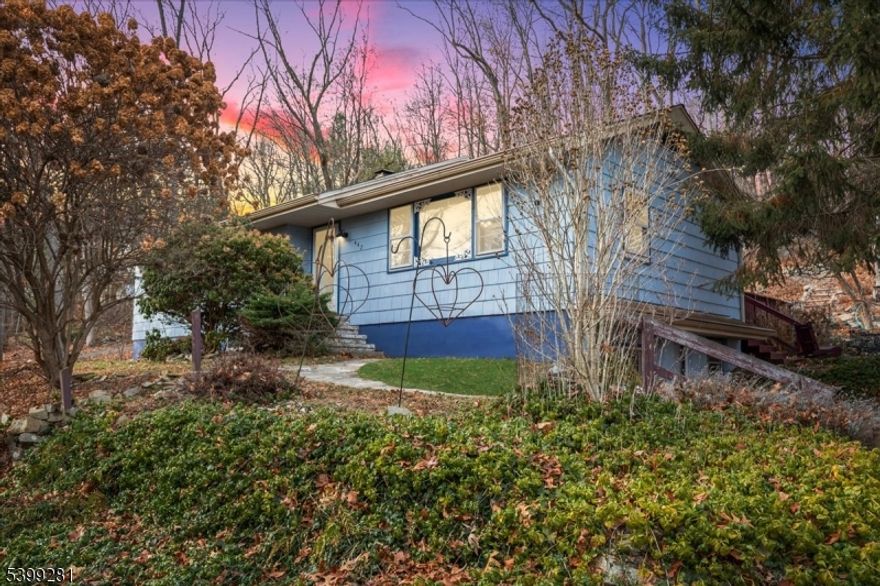 Backing to 40+ Acres of Open Space this Ranch home sits on a picturesque 1.51 acre property with lush landscaping & stone walls. The spacious living room with over-sized picture window has hardwood flooring that flows to the dining room. The dining room with rustic wood trimmed opening also features sliding glass doors to the rear deck & yard. The kitchen is loaded with character including the original custom wood cabinets, open shelving, tile backsplash & easy care wide plank flooring.  All bedrooms have hardwood flooring, ample closet storage & are conveniently located near the updated main bath with tub shower. The daylight walkout basement adds to your living space with a large family room featuring a window seat with storage. The basement also includes a private office, music studio with work area, full bath, mudroom & storage rooms. The expansive rear deck is great for entertaining  & overlooks your private rear yard & charming gazebo. Perfect for nature lovers this home has terraced gardens, picnic area with firepit, paver patios & walks. The oversized detached 2-car garage is great for hobbyist, collectors, contractors or car enthusiasts. Convenient location is close to shopping, dining & all Lebanon Township schools including prestigious Blue Ribbon Voorhees High School. Enjoy numerous nearby parks & recreation centers including Teetertown Ravine Nature Preserve, Columbia Trail & Ken Lockwoods Gorge. Great commute near Routes 78, 31, 22 & bus & train service.