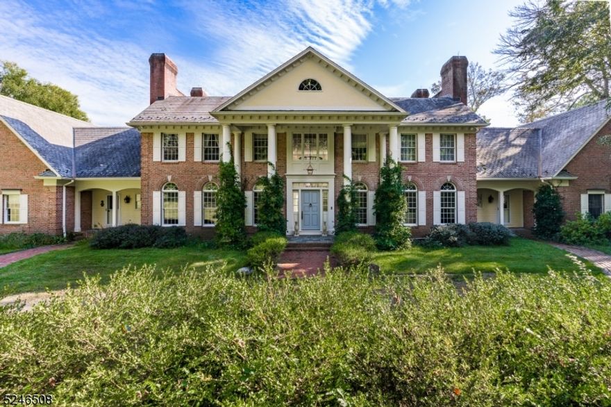 A private road leads to this estate set on over 20 acres with spectacular long countryside views. This custom Georgian-Colonial style residence offers multi-generational living in a home filled with fine architectural details, eight fireplaces, designer kitchen with new Wolf stove, center island with breakfast bar, furniture-quality cabinets, and windows capturing the natural light and scenic views. On this level also are the living and dining rooms, great room and library, all anchored by fireplaces. Adjacent to the kitchen is the light-filled breakfast room. Separated from the main part of residence by the garden room, is the in-law/ guest suite with living room, den, bedroom and bathroom. There is a separate entrance into the garden room. A beautiful powder room completes this level. A gracious stairway, in the back-to-front marble-floored foyer, ascends to the second floor which offers the oval railed area overlooking the entry foyer; the luxurious primary suite comprising  bedroom with fireplace, spa-like bathroom, walk-in closets and sitting room. Additionally there are three more bedrooms, all en suite. The walk-out lower level features an en suite bedroom, recreation room, family room with raised hearth brick fireplace, recreation room and  playroom.  There is a four-car garage. Located only minutes from major highways and convenient to golf courses, equestrian facilities, independent and public schools and fine dining.