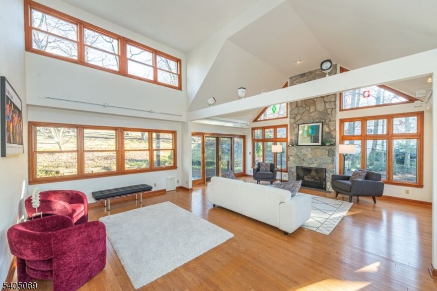 Well maintained, sun-drenched, 4 BR, 2.1 Bath Custom Cape. Over 2,500 Sq. Ft. featuring spectacular 26' great room with gorgeous floor-to-ceiling stone fireplace, vaulted ceilings, walls of windows and sliders to deck, patio and private .59 acre property. Located in desirable St. Cloud neighborhood with jitney to NYC train at corner and .5 mile to elementary school. Recent updates include new: painted interior, beautifully refinished hardwood floors, 2nd floor carpet and decking. Full finished basement with rec room, workshop, laundry room, 1/2 bath, lots of storage and entry to spacious two car garage. Central air. Conveniently located near Rt. 280 and GSP, NYC bus and train, Codey Arena, shops, restaurants, S. Mountain Reservation and the Turtle Back Zoo. House is being sold as-is.