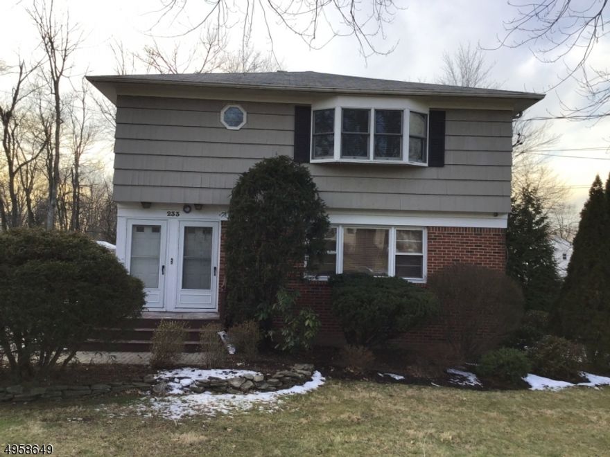 Beautifully updated, sun-filled second floor apartment, offering 3 bedrooms and 1.5 bathrooms.  This spacious home features a large living room and a formal dining room with custom wainscoting.  The open kitchen is thoughtfully designed with wood cabinets, granite countertops, stainless steel appliances and a wine cooler/beverage cooler.  Wood floors throughout the bedrooms and hallway.  Additional conveniences include CA, separate washer/dryer (in basement), one car garage parking and a prime location close to NYC commuter train, schools, parks and a vibrant NP downtown shopping and restaurants.