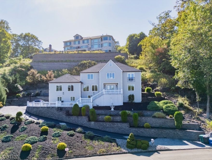 Gorgeous, custom-built Colonial that sits at the end of a cul-de-sac in Cedar Grove's coveted Park Ridge Estate section, capturing breathtaking views and exceptional privacy. Set on a 20,973 SF lot, the home offers 4,250 sf across 10 rooms, including 4 bedrooms, 3.5 bathrooms & a finished basement. A thoughtful, flexible layout accommodates both everyday living and elegant entertaining, while central air conditioning and forced hot-air heat deliver year-round comfort. Practical upgrades include a new roof and the three-car garage provides ample parking and storage. Outdoors, the expansive grounds invite gardening, play and future outdoor-living ideas. A rare blend of scale, setting and construction quality move-in ready luxury in Cedar Grove