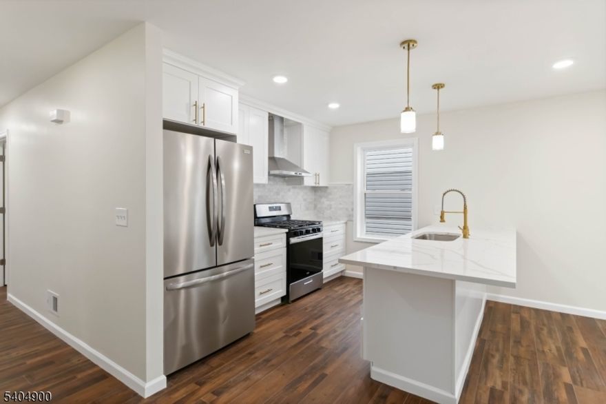 Exquisite New Construction Residence in Irvington-Experience refined living in this impeccably crafted new construction multi-unit home offering a total of 6 bedrooms and 4.5 baths, designed for both elegant owner-occupancy and premium investment potential. Each residence features central air conditioning and forced hot air, delivering year-round comfort and efficiency. The chef-inspired kitchens are beautifully appointed with striking quartz countertops, oversized center islands, and dishwashers, blending sophistication with everyday functionality perfect for entertaining and elevated daily living. Sun-filled open-concept living and dining areas showcase modern finishes and thoughtful architectural details throughout. The primary suite serves as a private sanctuary, complete with a spa-like ensuite bath. An attached garage paired with an exceptionally rare 7-car driveway provides unparalleled parking convenience. This distinguished property offers the luxury of new construction with proximity to shopping, schools, transportation, and major highways. A rare opportunity to own a statement multi-family residence that seamlessly combines space, design, and modern luxury in the heart of Irvington. The property qualifies for CRA loan programs offering below-market interest rates and no private mortgage insurance.Taxes are subject to change post closing Seller will apply for Tax Abatement with the Township.